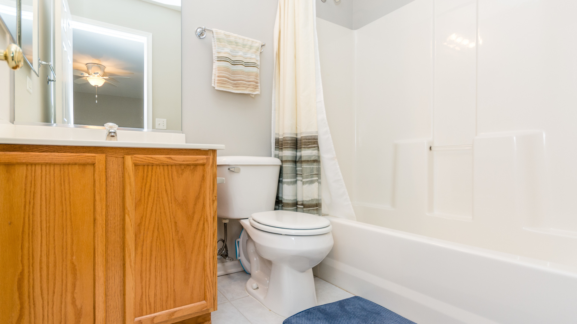 141 Enclave Circle, Unit B Bolingbrook, IL 60440 - Photo 32 of 41 a bathroom with a sink and a mirror