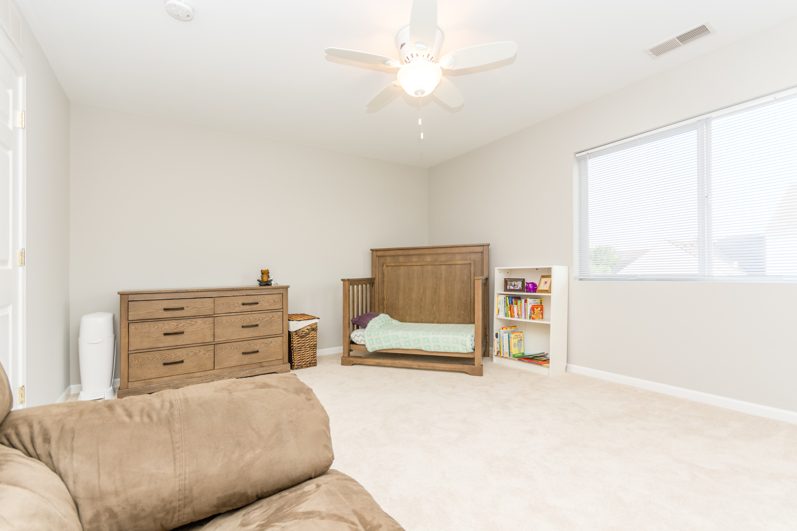 141 Enclave Circle, Unit B Bolingbrook, IL 60440 - Photo 35 of 41 a bedroom with a bed and a cabinets