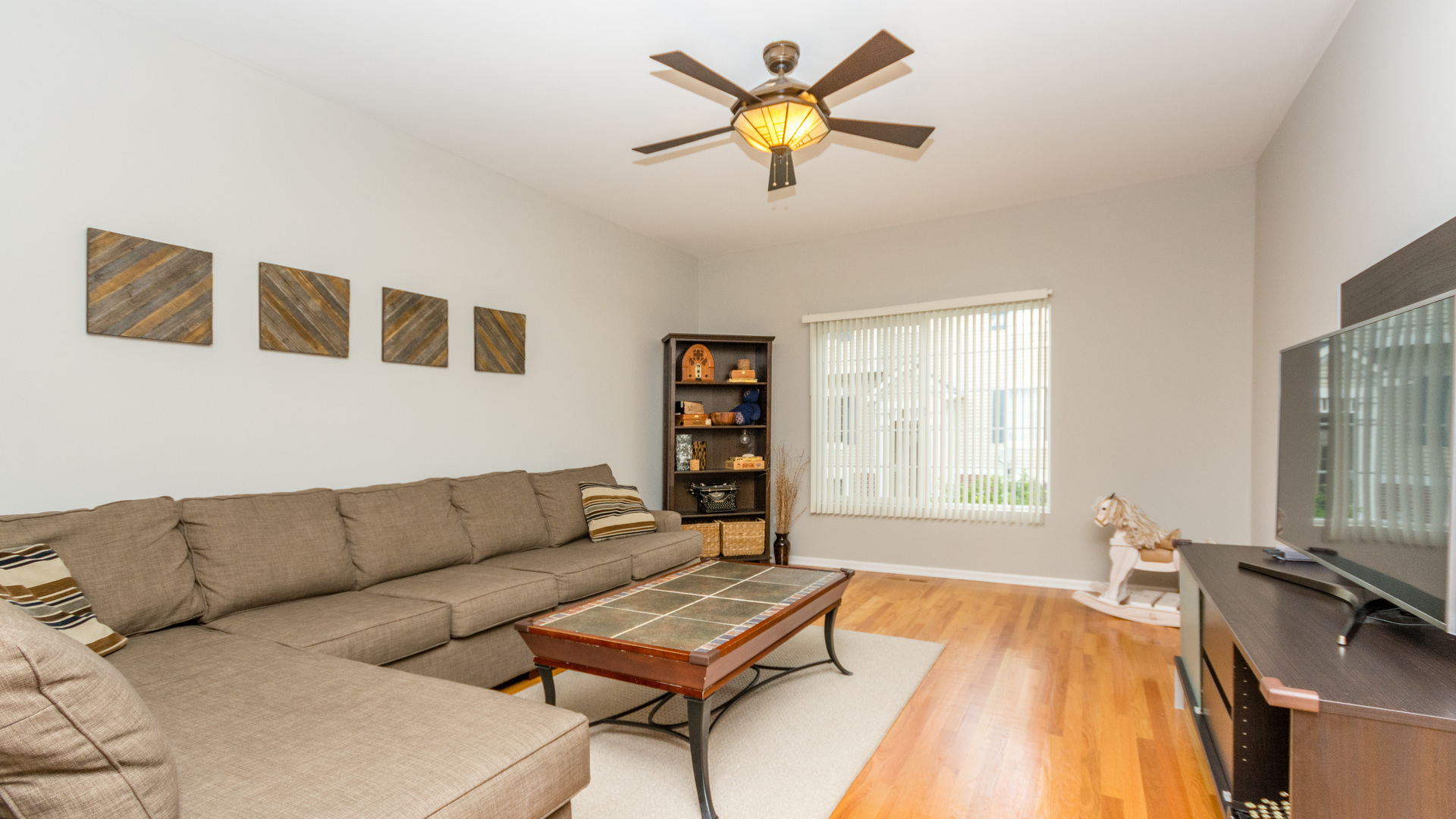 141 Enclave Circle, Unit B Bolingbrook, IL 60440 - Photo 6 of 41 a living room with furniture and a large window