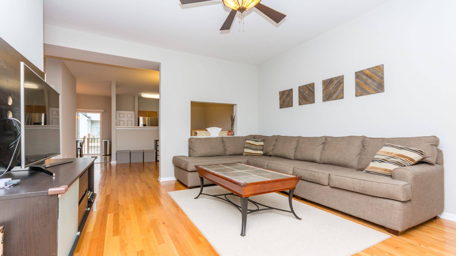141 Enclave Circle, Unit B Bolingbrook, IL 60440 - Photo 7 of 41 a living room with furniture and a wooden floor