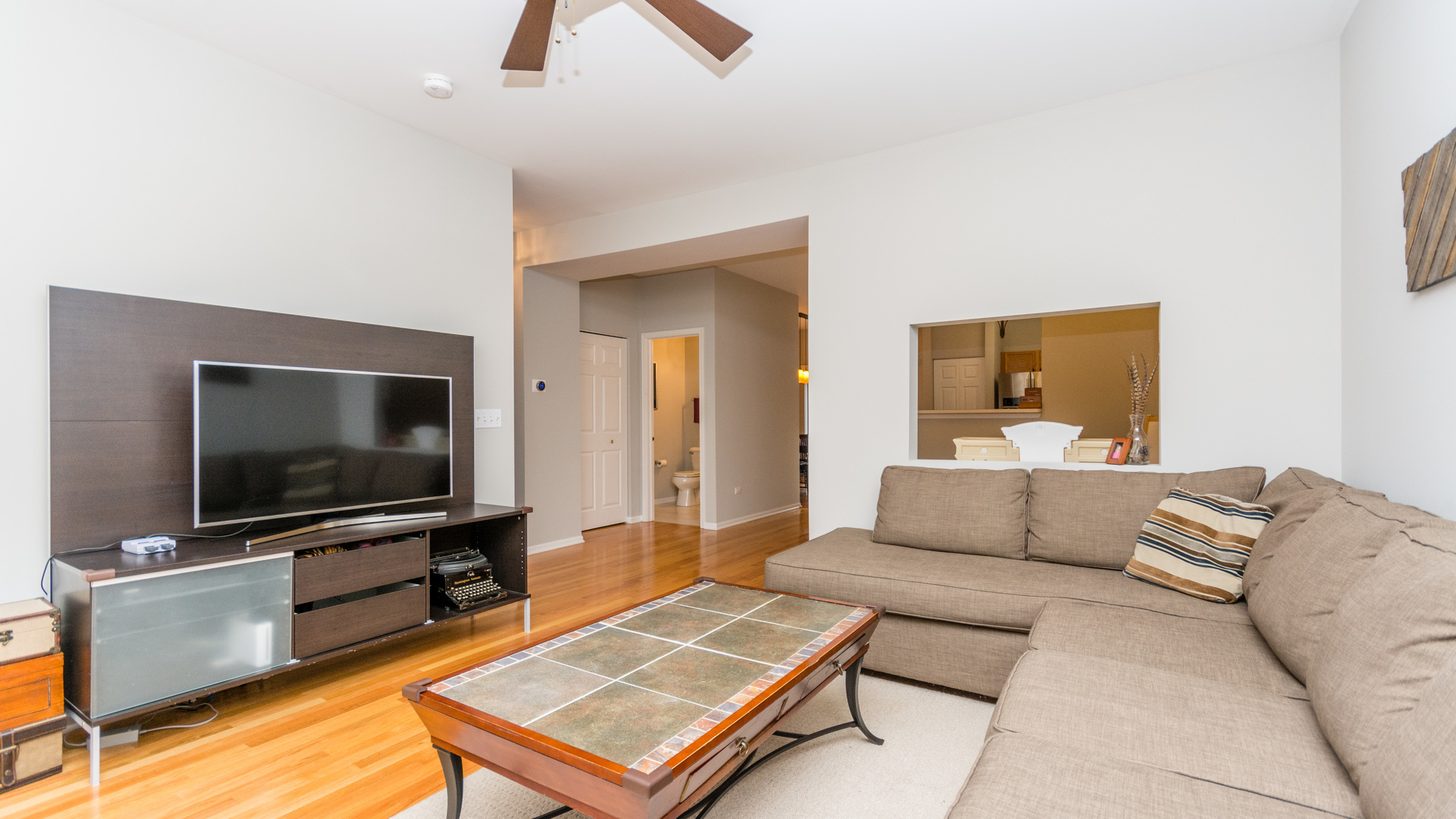 141 Enclave Circle, Unit B Bolingbrook, IL 60440 - Photo 8 of 41 a living room with furniture and a flat screen tv