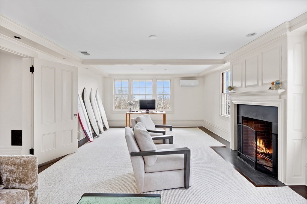 15 Old Neck Road Manchester, MA 01944 - Photo 15 of 24 a living room with furniture and a fireplace