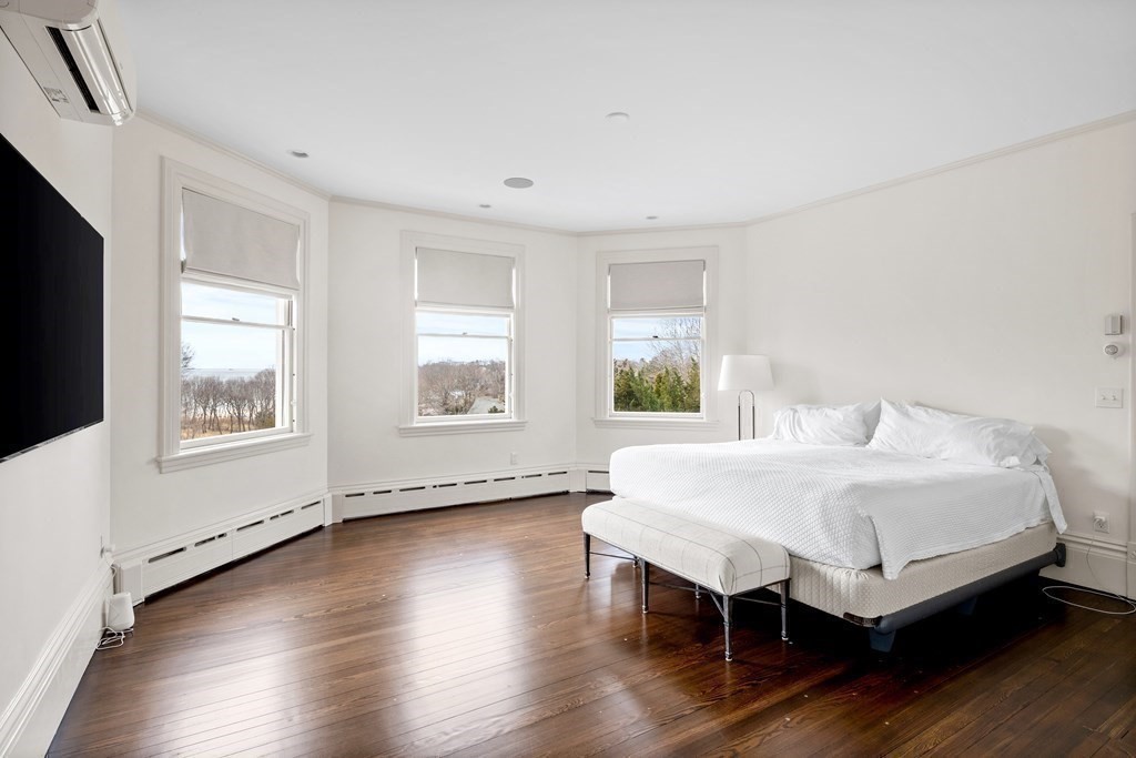 15 Old Neck Road Manchester, MA 01944 - Photo 17 of 24 a bedroom with a bed and a large window