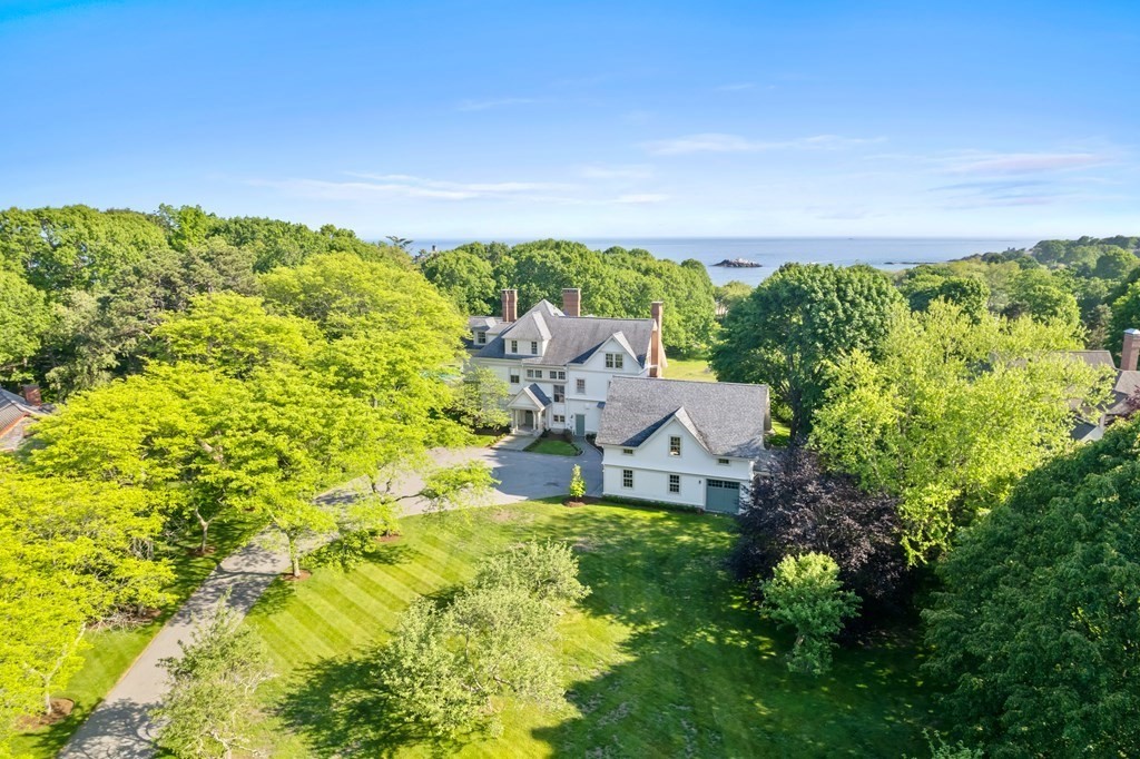 15 Old Neck Road Manchester, MA 01944 - Photo 2 of 24 a aerial view of a house with a yard basket ball court and outdoor seating
