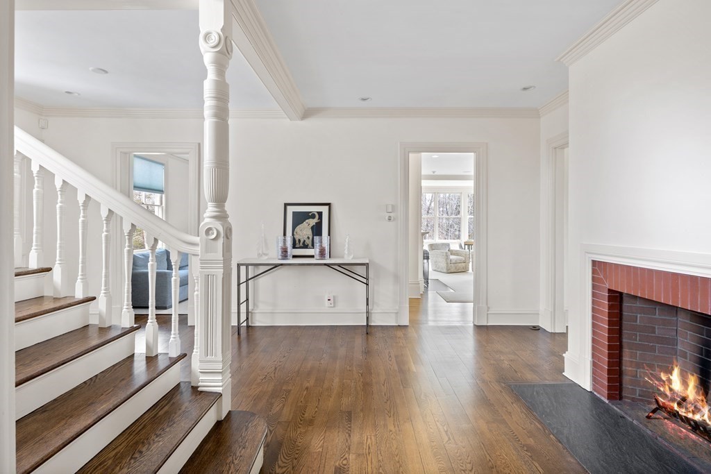 15 Old Neck Road Manchester, MA 01944 - Photo 5 of 24 a view of a livingroom with wooden floor and a fireplace