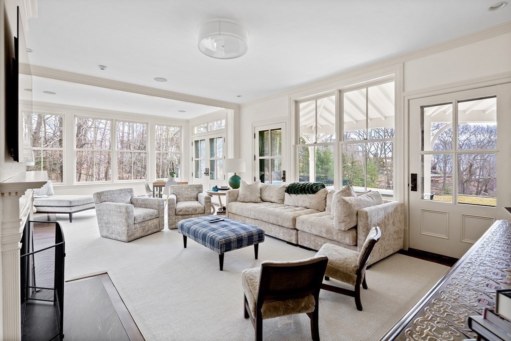 15 Old Neck Road Manchester, MA 01944 - Photo 7 of 24 a living room with furniture and floor to ceiling windows