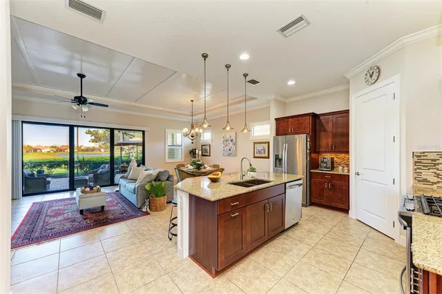 a living room with furniture and a chandelier