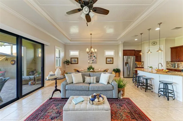 a bathroom with a granite countertop sink toilet and painting on the wall