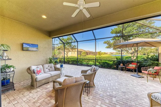 a living room with furniture and a view of bathroom