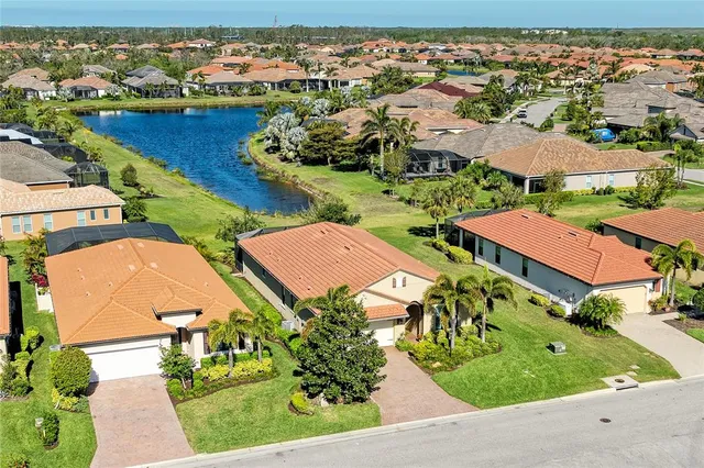 an aerial view of house with yard