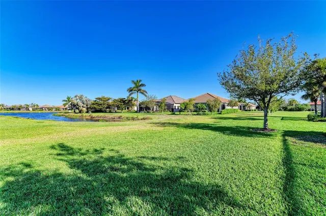 a view of a hallway with wooden floor and a fireplace