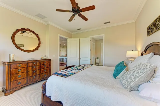 a living room with lots of furniture and a large window