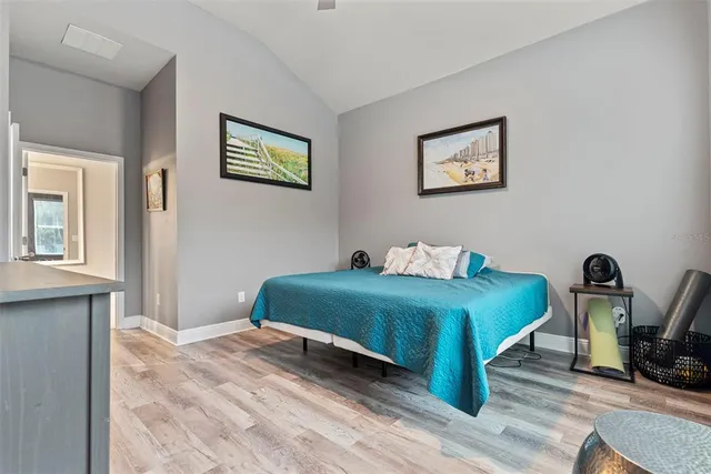 a bedroom with bed and a window