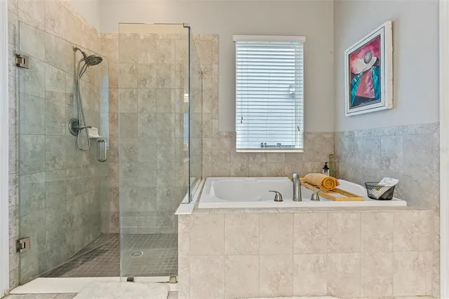 a bath tub sitting next to a bathroom sink