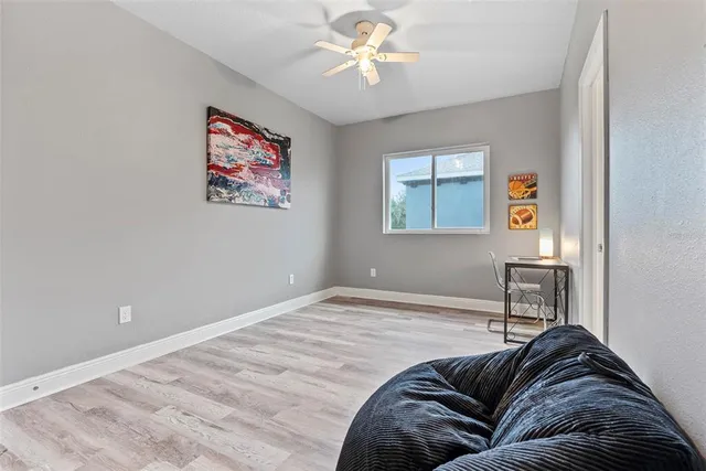 a living room with furniture and a window