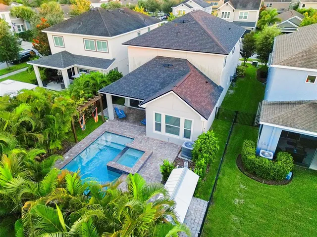 a aerial view of a house with a yard