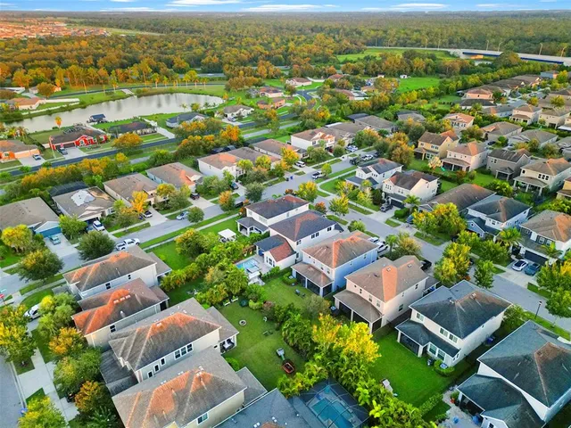 an aerial view of residential houses with outdoor space