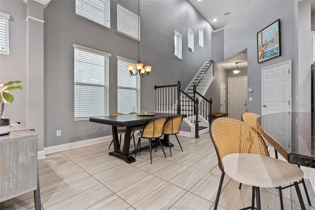 a dining room with furniture and window