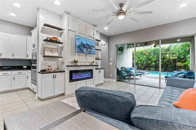 a living room with furniture and a fireplace