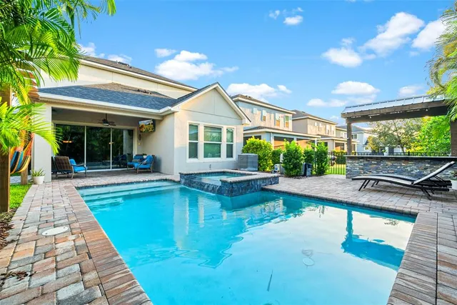 a view of a swimming pool with a patio