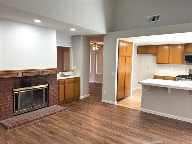 a kitchen with granite countertop a stove and a refrigerator