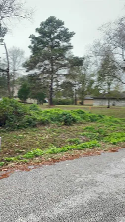 a view of a yard with an outdoor space