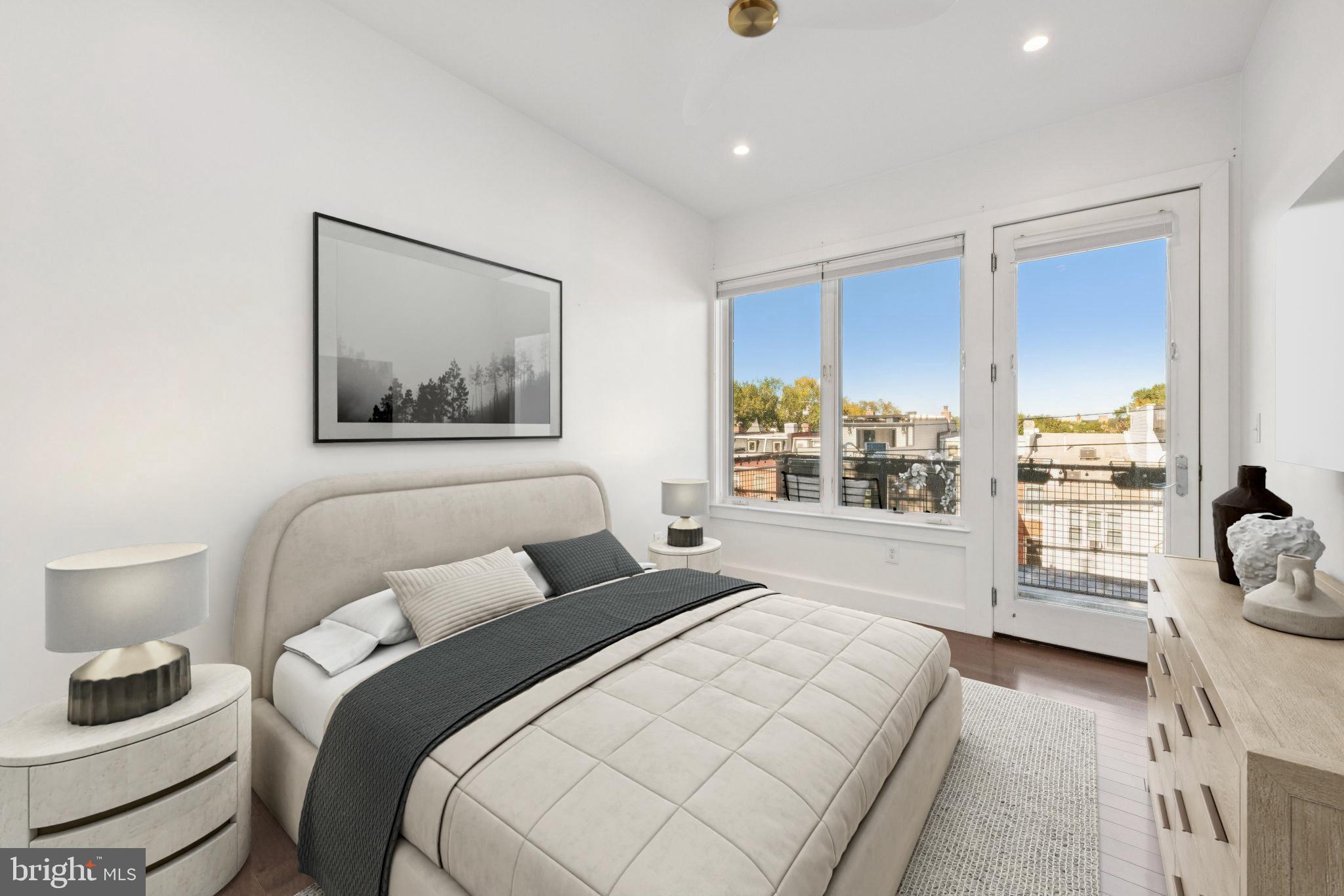1767 Lanier Place Northwest, Unit 6 Washington, DC 20009 - Photo 10 of 49 a bedroom with a bed and glass window