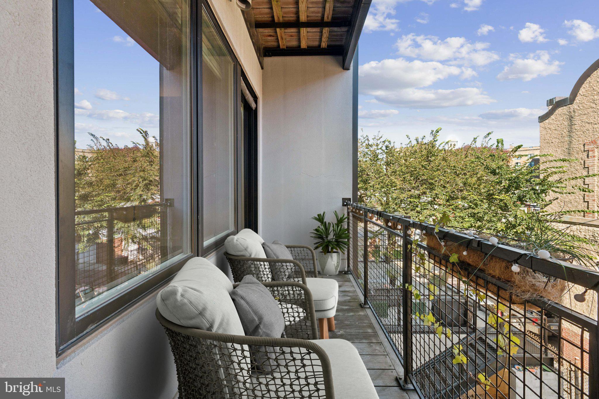 1767 Lanier Place Northwest, Unit 6 Washington, DC 20009 - Photo 1 of 49 a view of balcony with furniture
