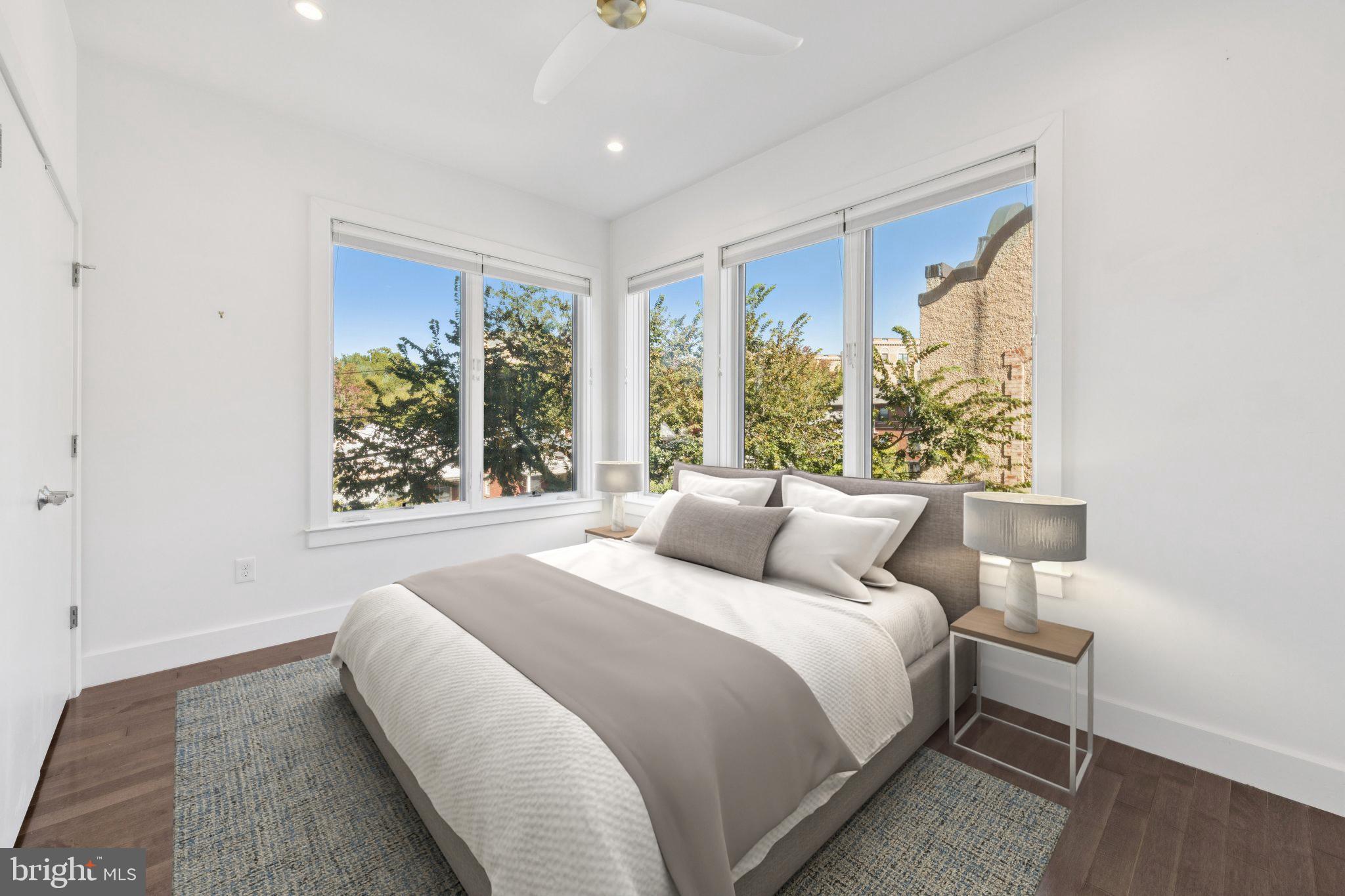 1767 Lanier Place Northwest, Unit 6 Washington, DC 20009 - Photo 2 of 49 a bedroom with a bed and a large window