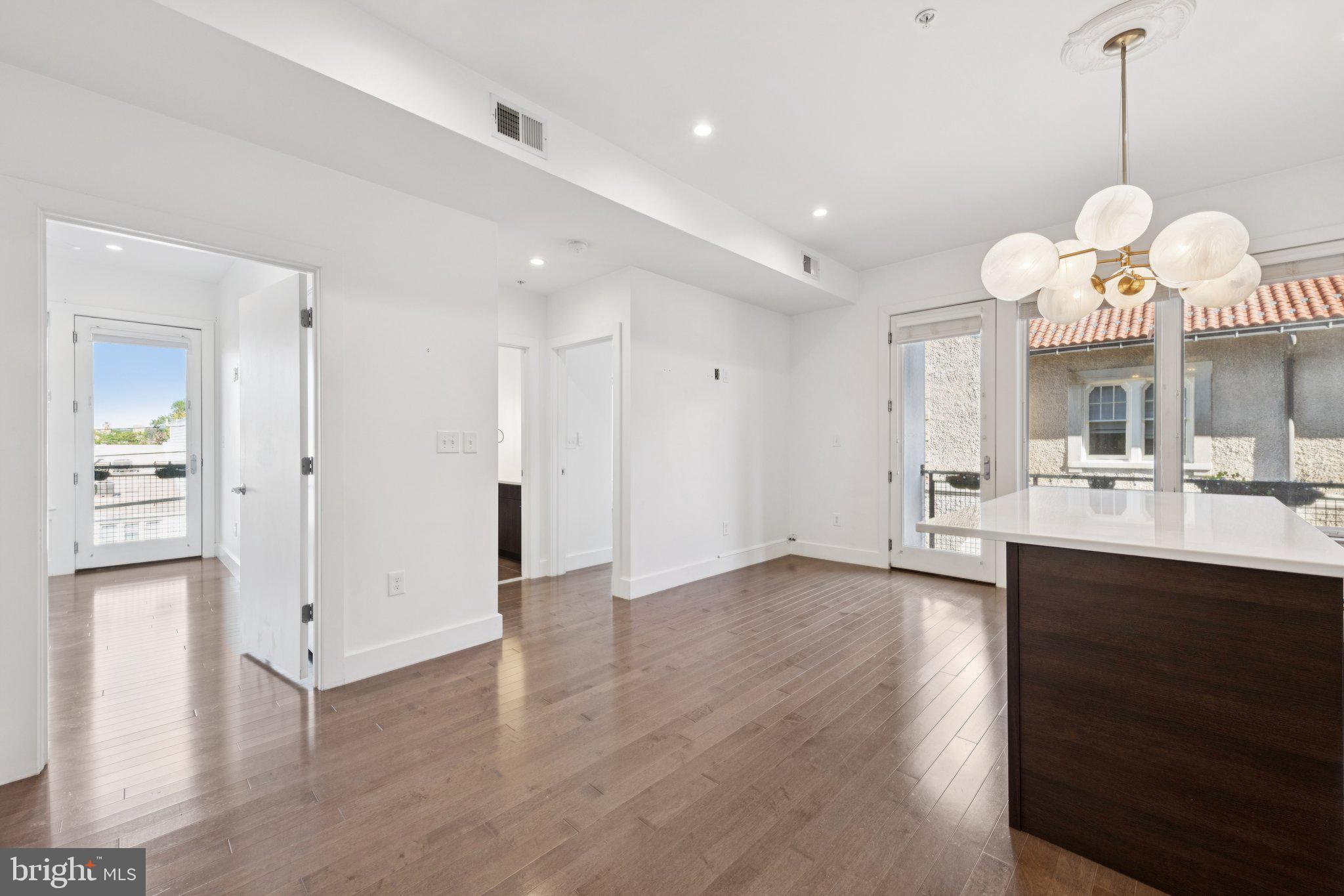 1767 Lanier Place Northwest, Unit 6 Washington, DC 20009 - Photo 31 of 49 a view of a kitchen and a sink window wooden floor