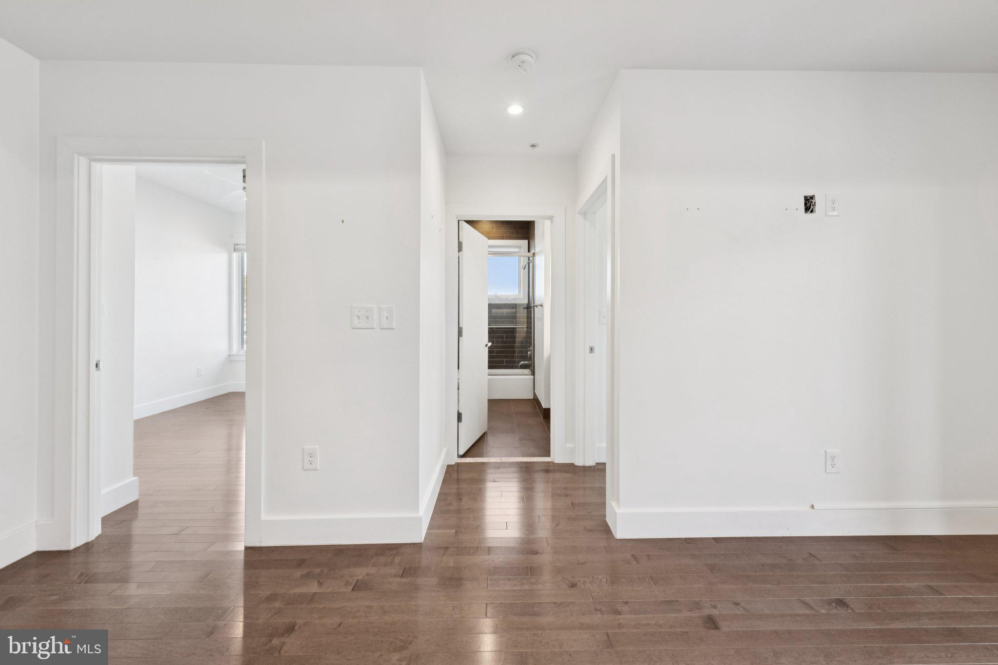 1767 Lanier Place Northwest, Unit 6 Washington, DC 20009 - Photo 32 of 49 a view of a hallway with wooden floor