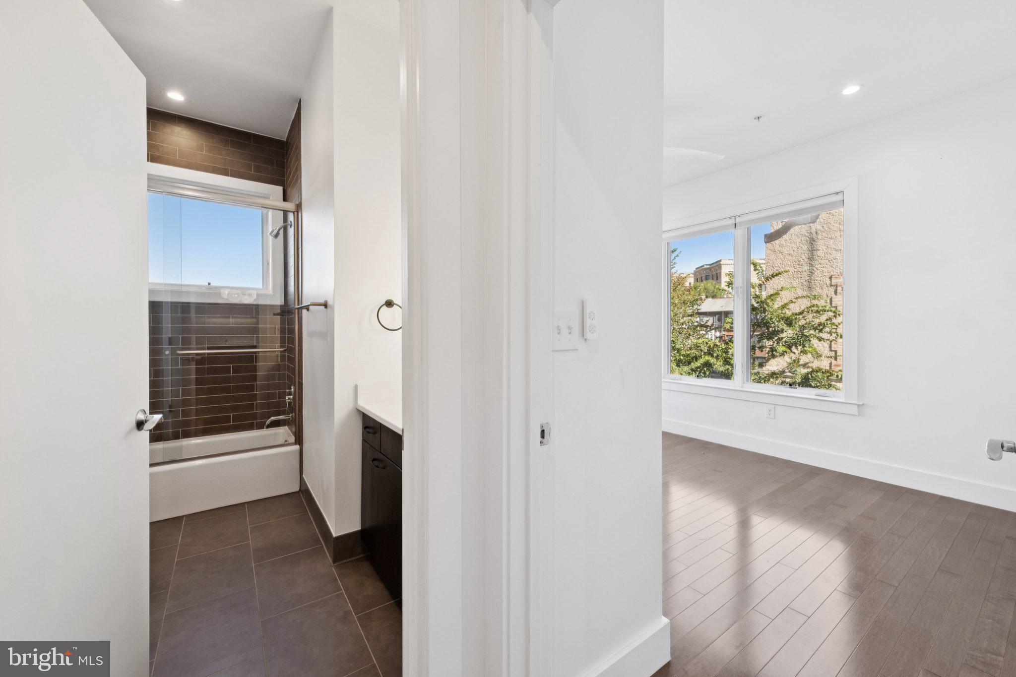 1767 Lanier Place Northwest, Unit 6 Washington, DC 20009 - Photo 33 of 49 a view of hallway with washer and dryer