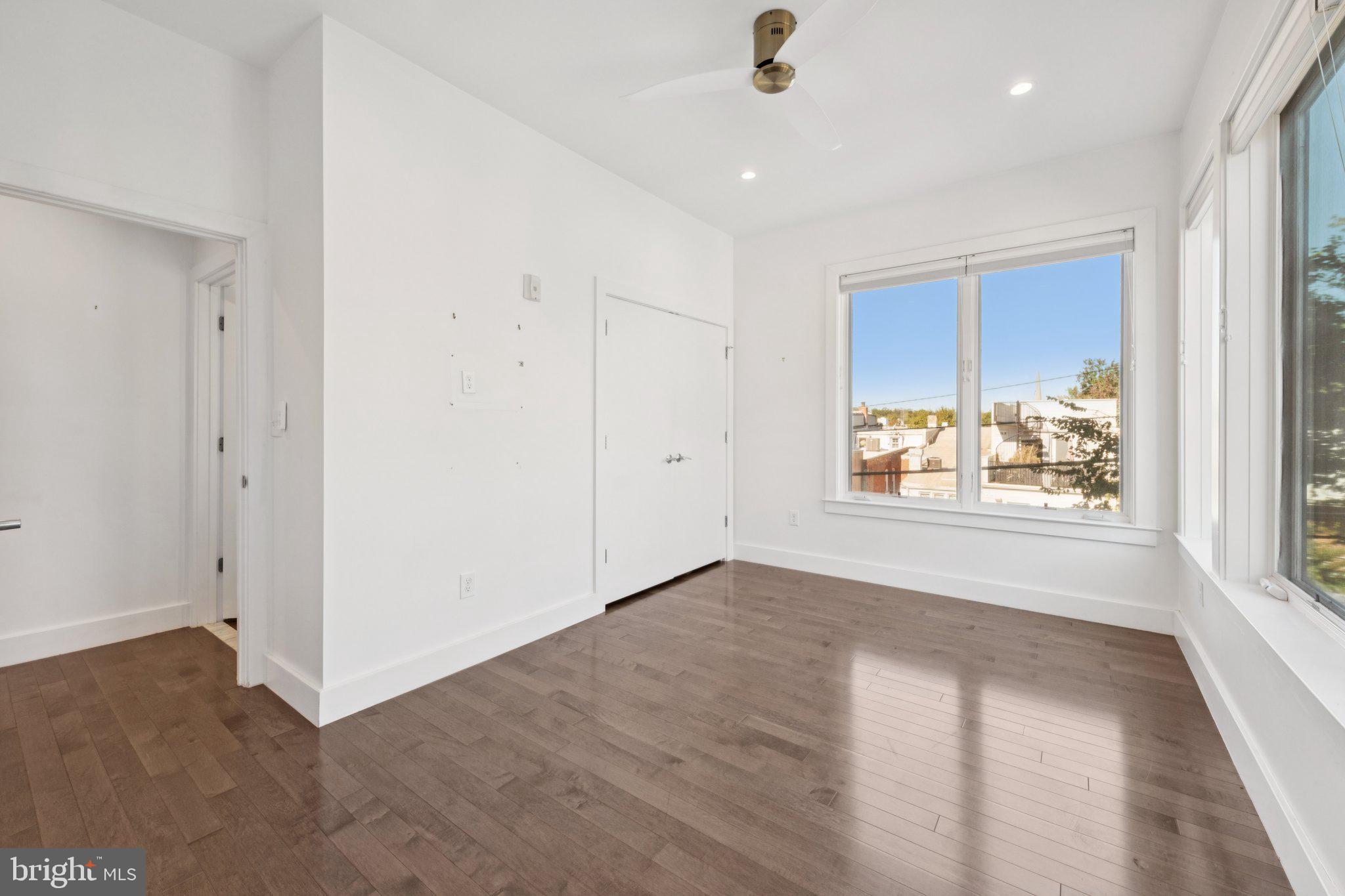 1767 Lanier Place Northwest, Unit 6 Washington, DC 20009 - Photo 38 of 49 wooden floor in an empty room with a window