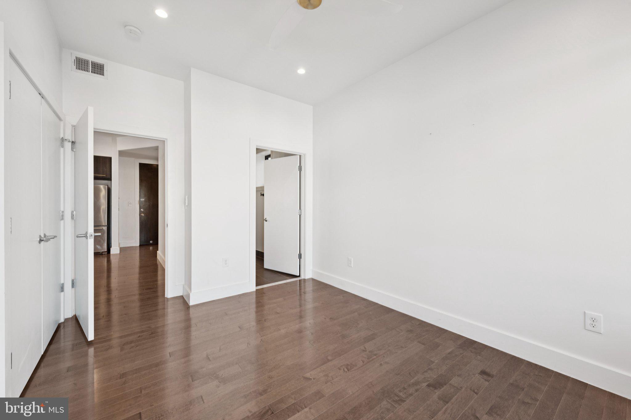 1767 Lanier Place Northwest, Unit 6 Washington, DC 20009 - Photo 40 of 49 a view of an empty room with wooden floor