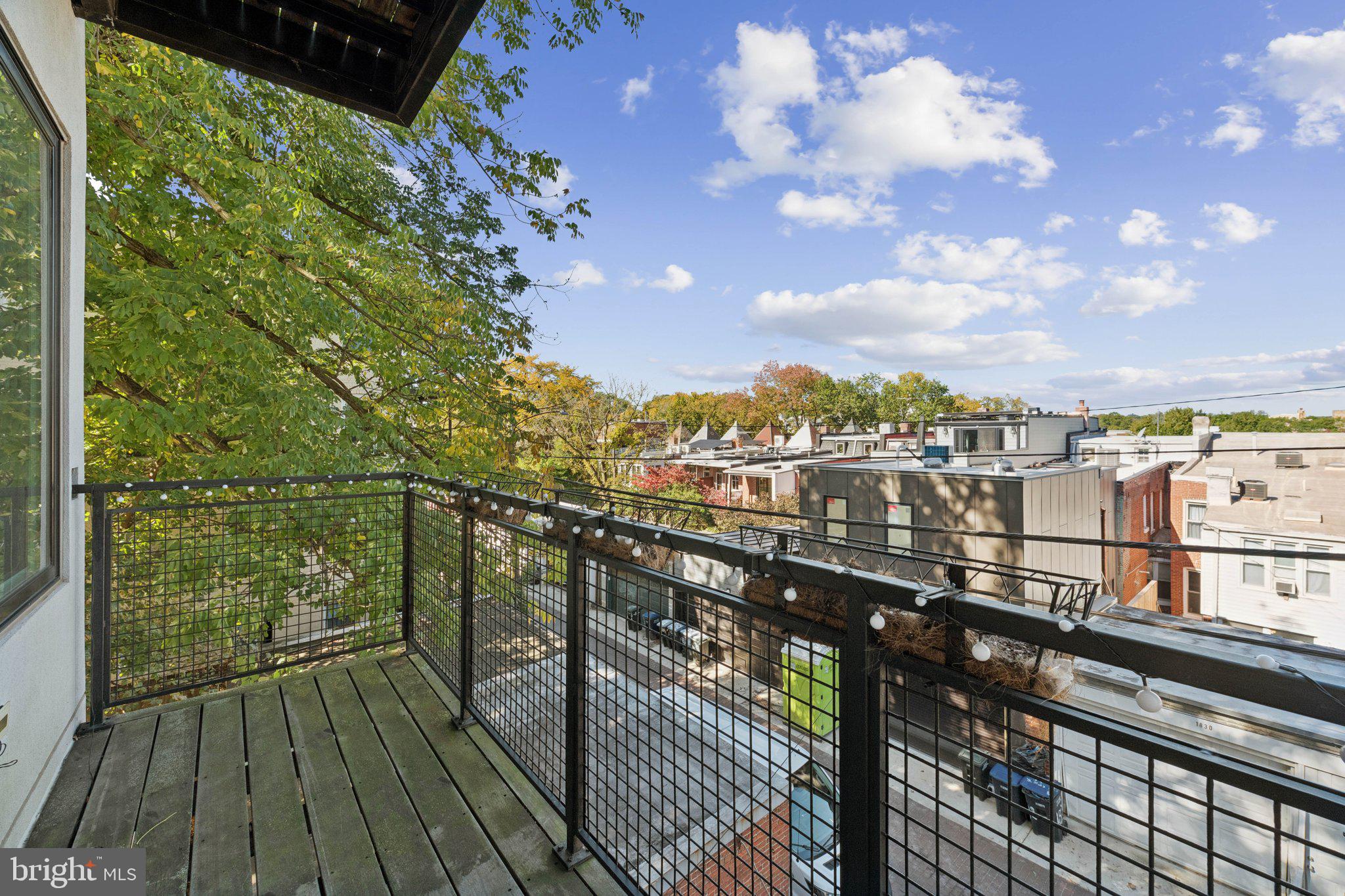 1767 Lanier Place Northwest, Unit 6 Washington, DC 20009 - Photo 44 of 49 a view of city from a balcony