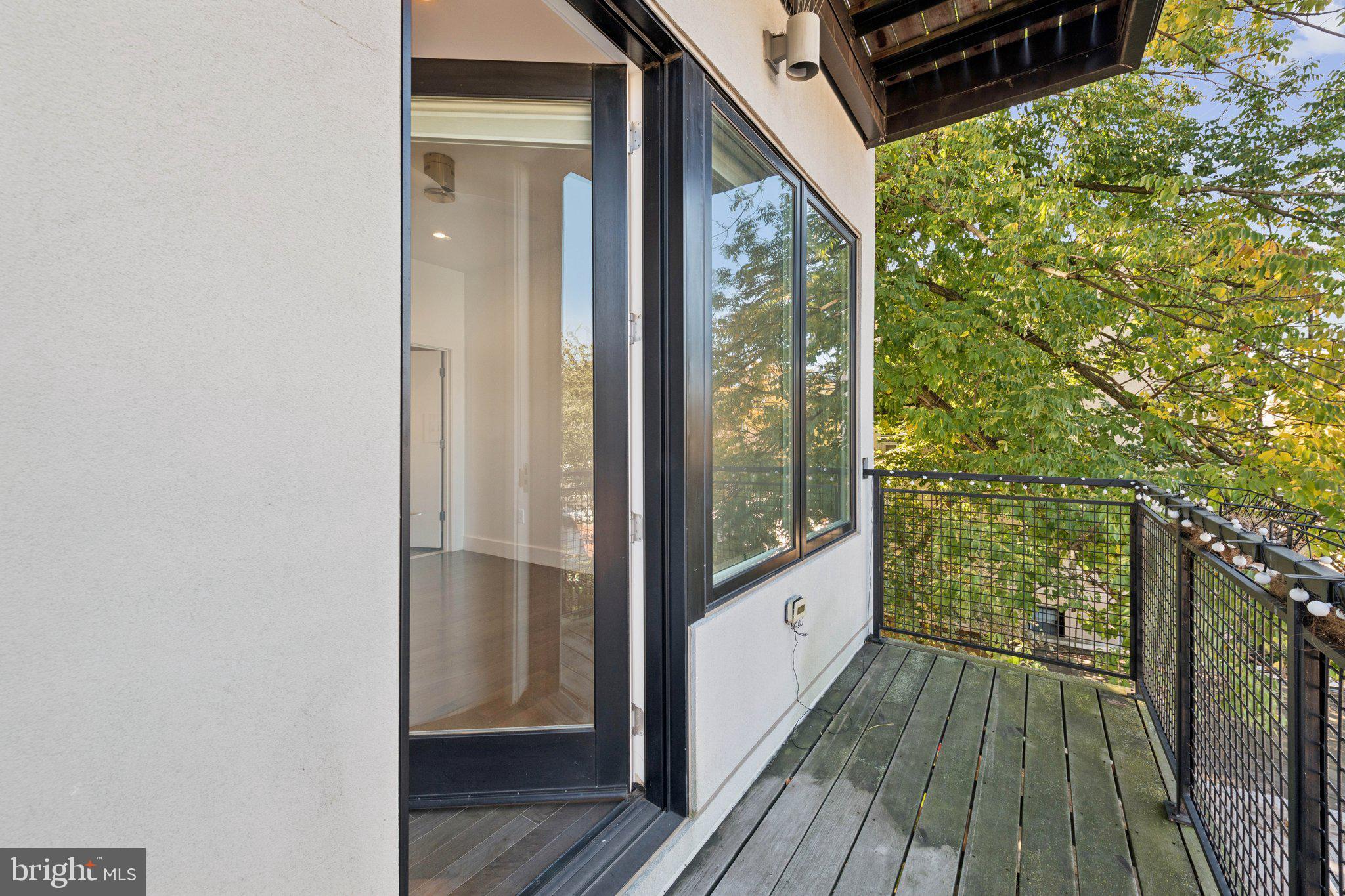 1767 Lanier Place Northwest, Unit 6 Washington, DC 20009 - Photo 45 of 49 a view of a balcony with wooden floor