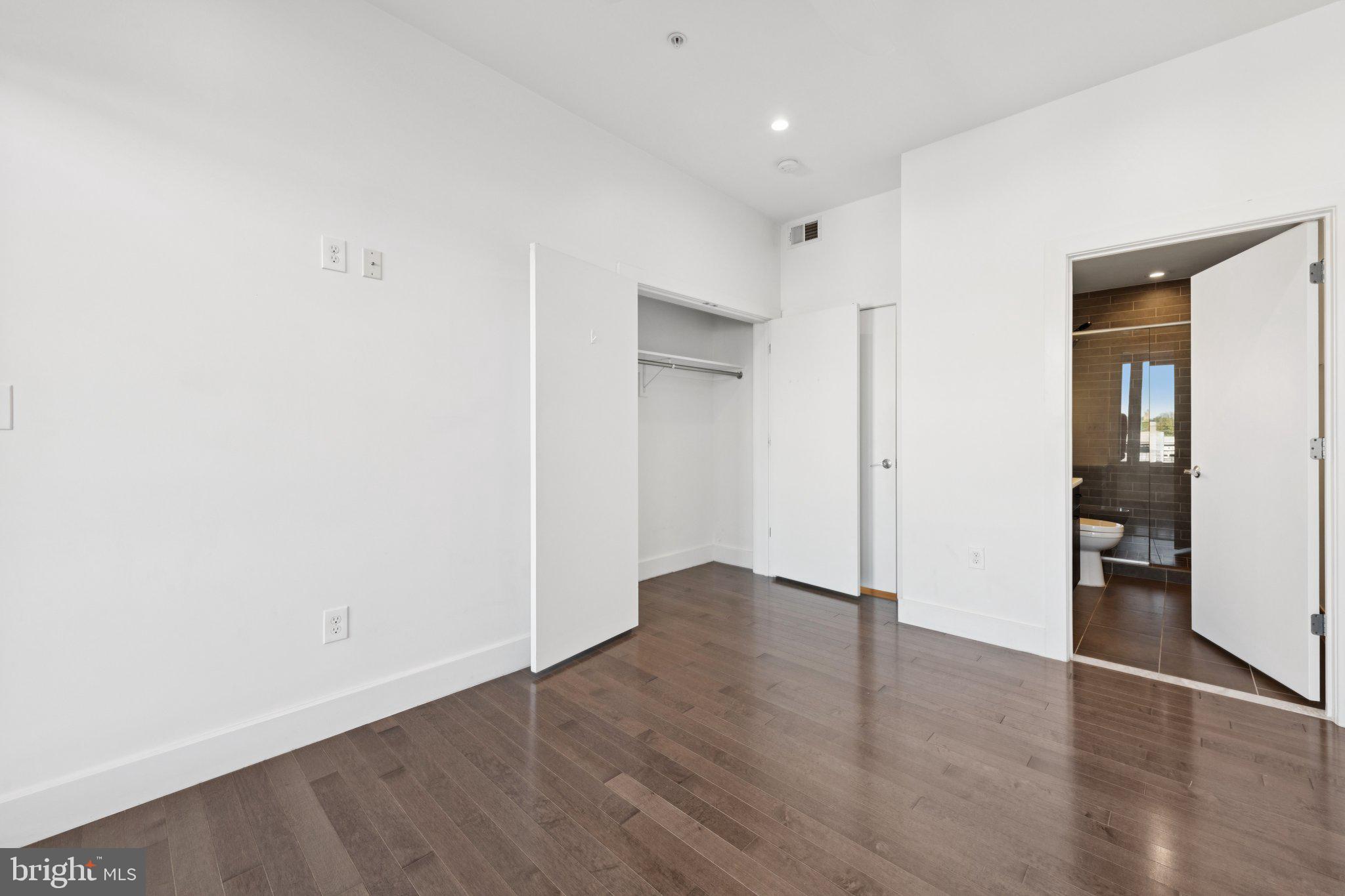 1767 Lanier Place Northwest, Unit 6 Washington, DC 20009 - Photo 47 of 49 a view of an empty room with wooden floor and closet