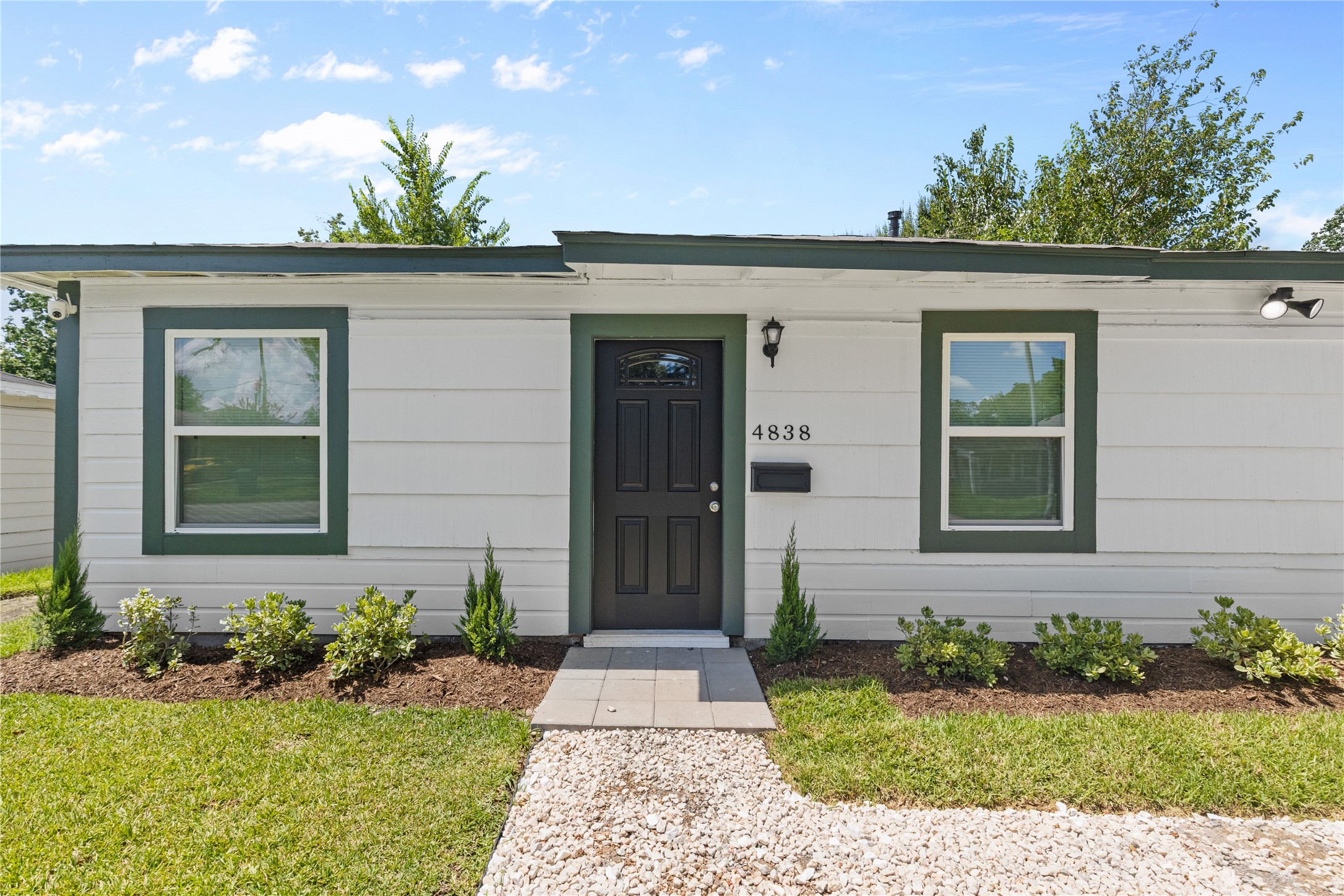 4838 Van Fleet Street Houston, TX 77033 - Photo 2 of 19 Freshly painted with new shrubbery and gravel, this home offers a welcoming and modern curb appeal.