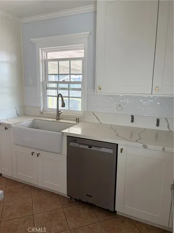 a view with cabinets window a sink and dishwasher