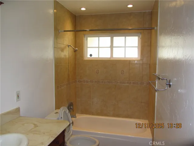 a bathroom with a bathtub and shower