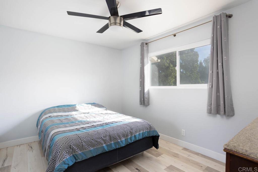 8420 Fanita Drive, Unit 3 Santee, CA 92071 - Photo 14 of 21 a bedroom with a bed and a window