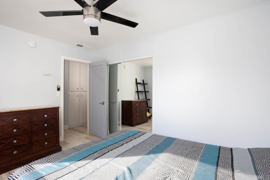8420 Fanita Drive, Unit 3 Santee, CA 92071 - Photo 15 of 21 a bedroom with a bed and a dresser