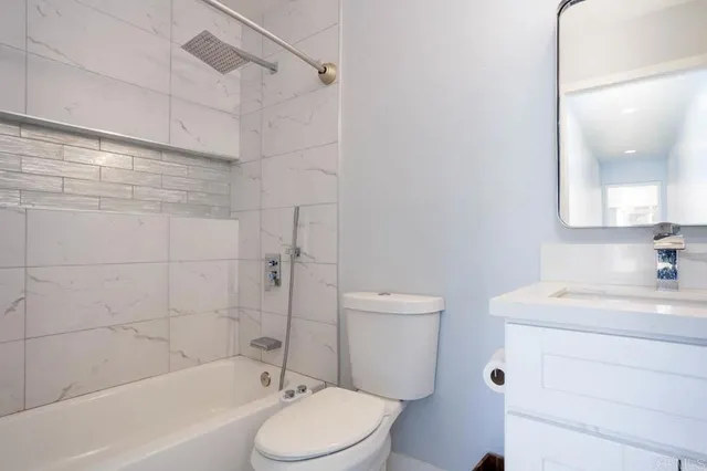 a bathroom with a sink a toilet and a bathtub