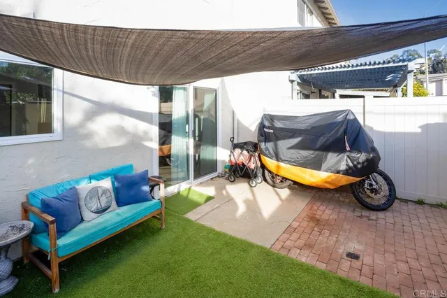 a view of a swimming pool with a patio