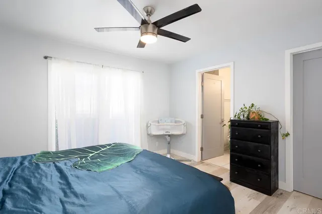 a bedroom with a bed and a dresser