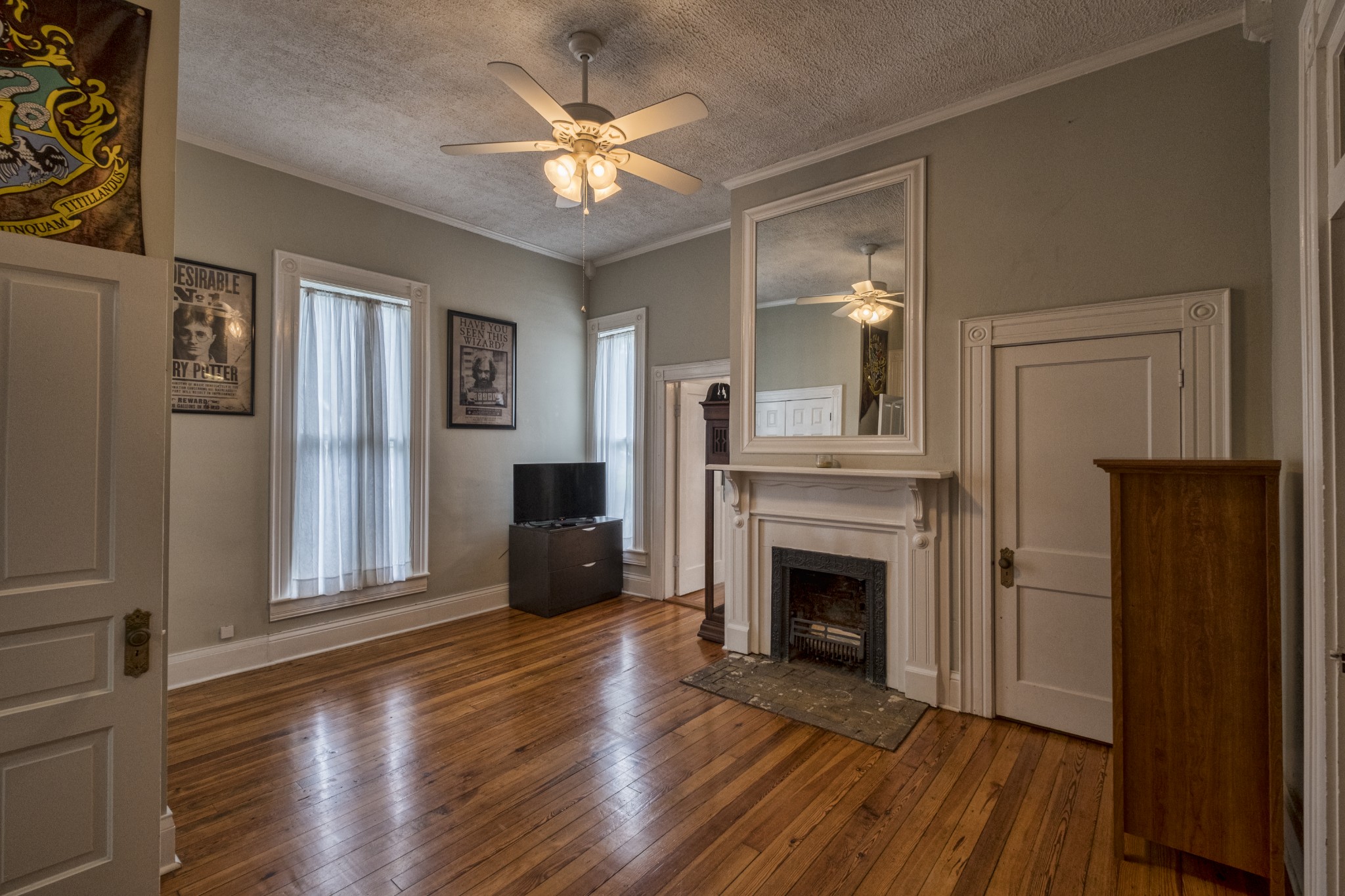 211 North Main Street Springfield, TN 37172 - Photo 12 of 30 a view of a livingroom with wooden floor a fireplace and window