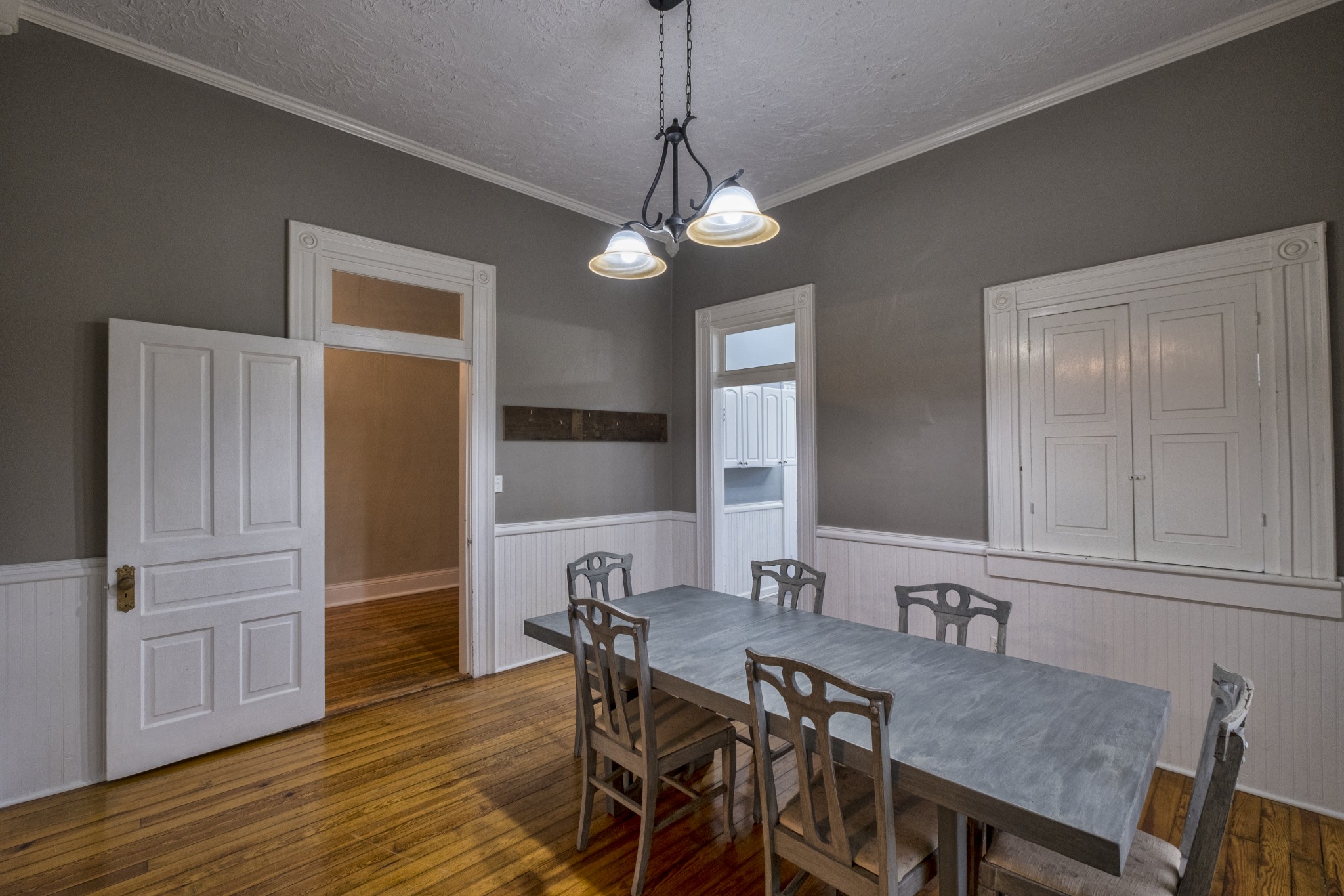 211 North Main Street Springfield, TN 37172 - Photo 13 of 30 a view of a dining room with furniture wooden floor and chandelier
