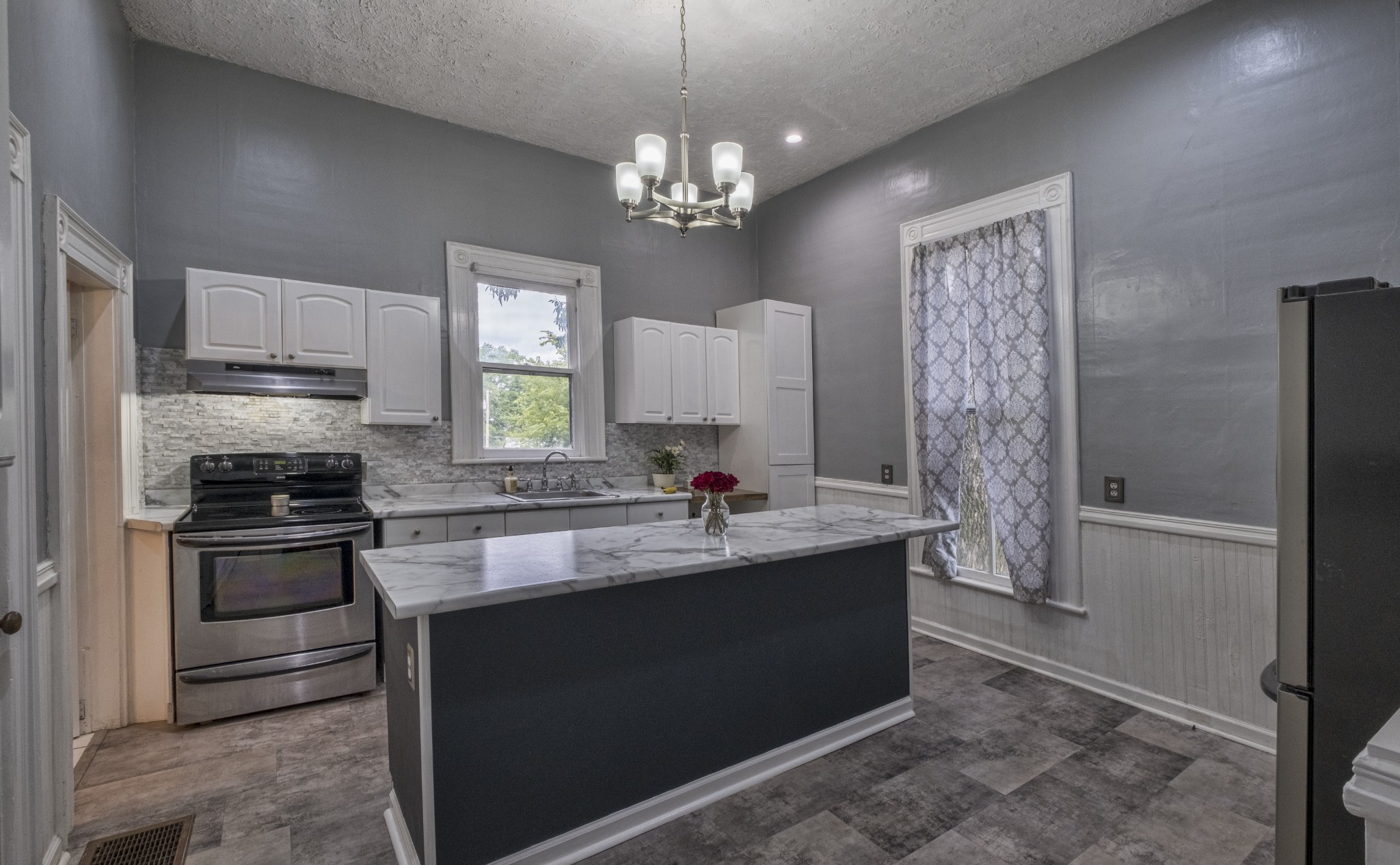 211 North Main Street Springfield, TN 37172 - Photo 15 of 30 a kitchen with stainless steel appliances granite countertop a sink stove and refrigerator