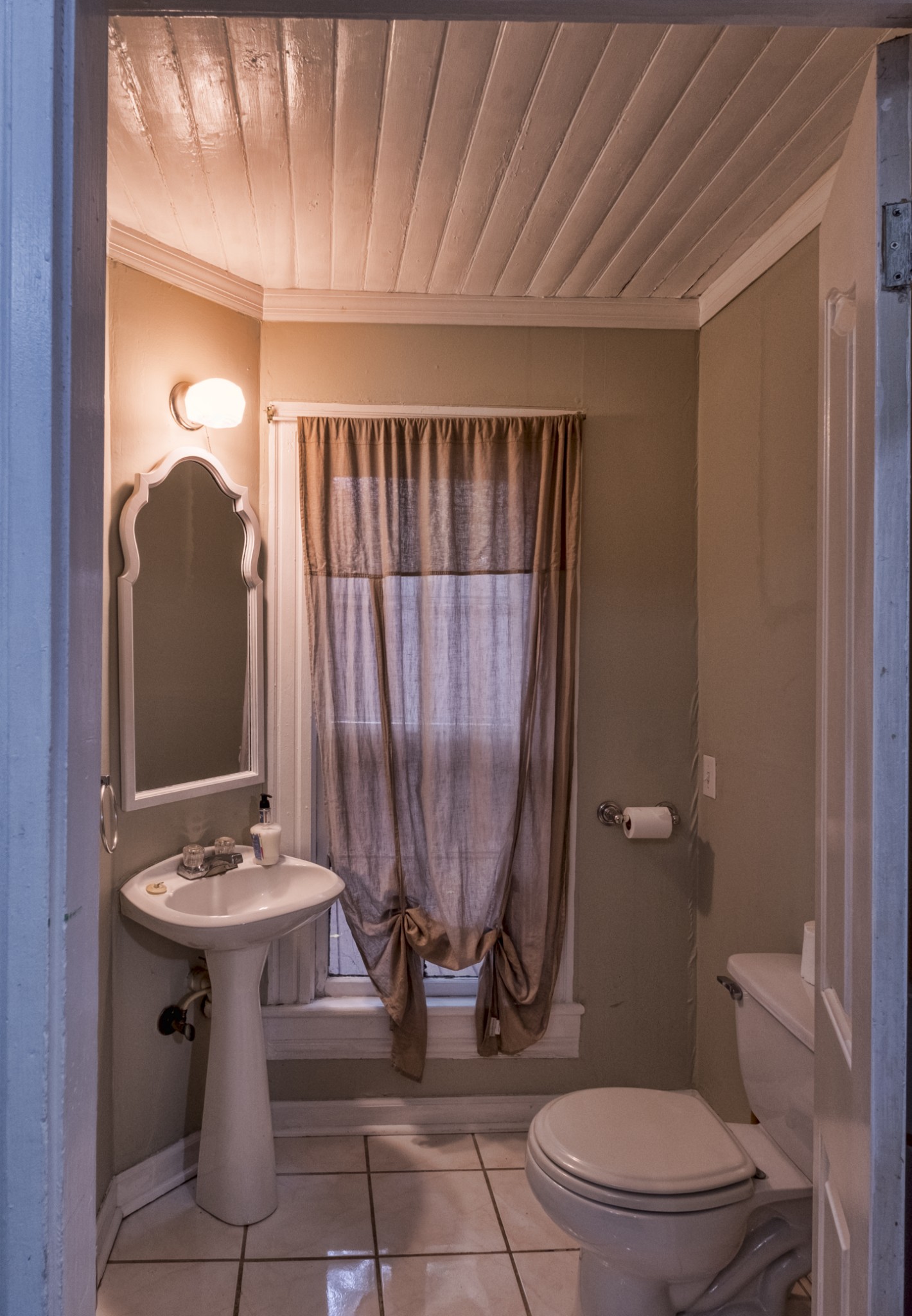211 North Main Street Springfield, TN 37172 - Photo 17 of 30 a bathroom with a toilet a sink and mirror