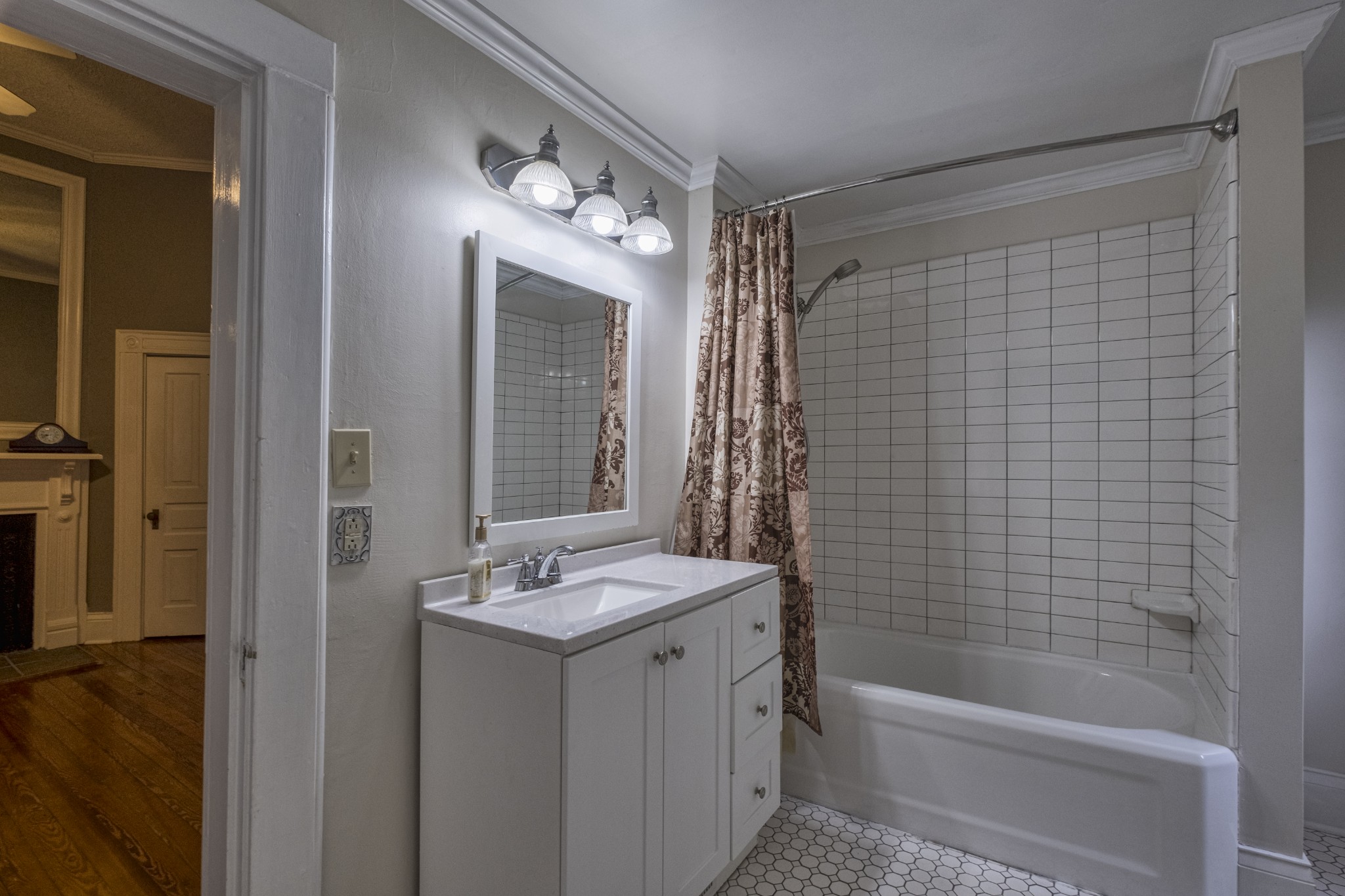 211 North Main Street Springfield, TN 37172 - Photo 20 of 30 a bathroom with a bathtub a sink and a shower